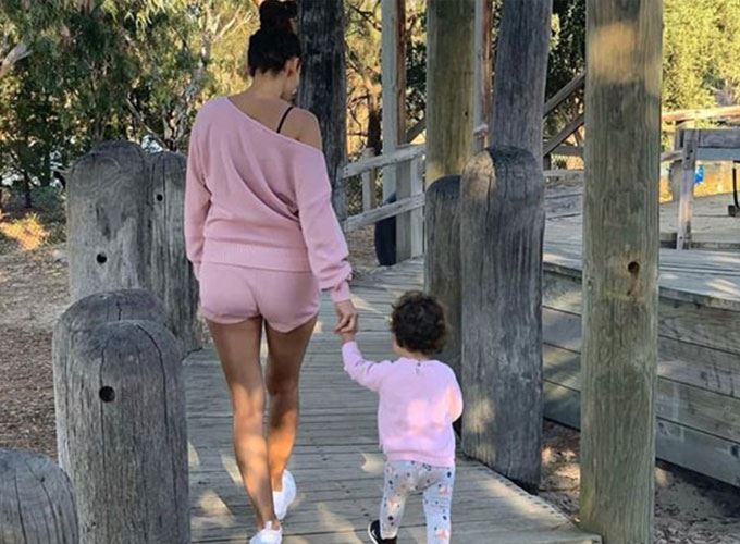 Snez walking with baby willow along the boardwalk